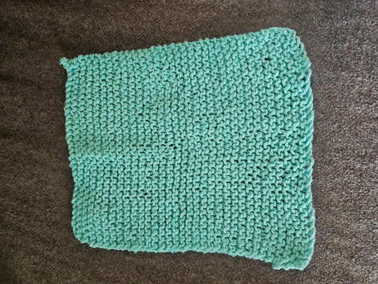 Light blue hand knitted washcloth