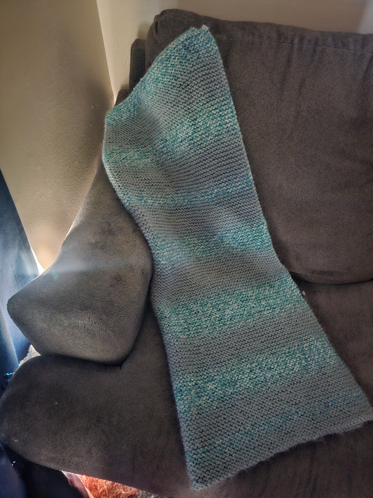Hand knitted blue lap blanket
