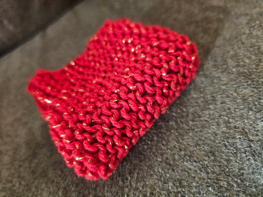 Hand knitted washcloth with gold accents