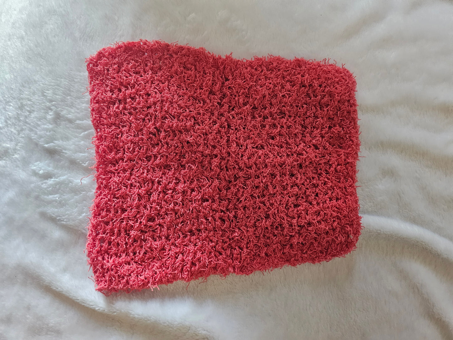 Hand knitted scrubby washcloth