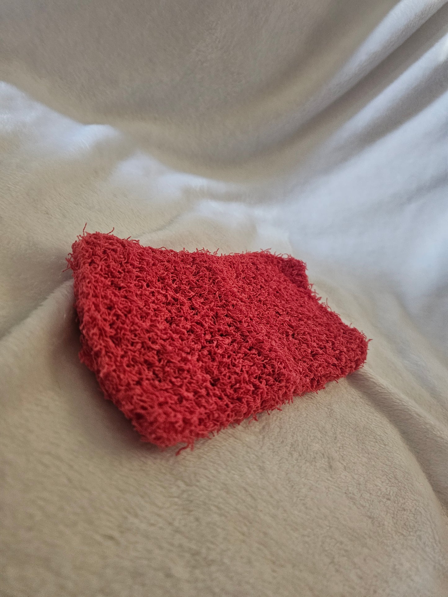Hand knitted scrubby washcloth