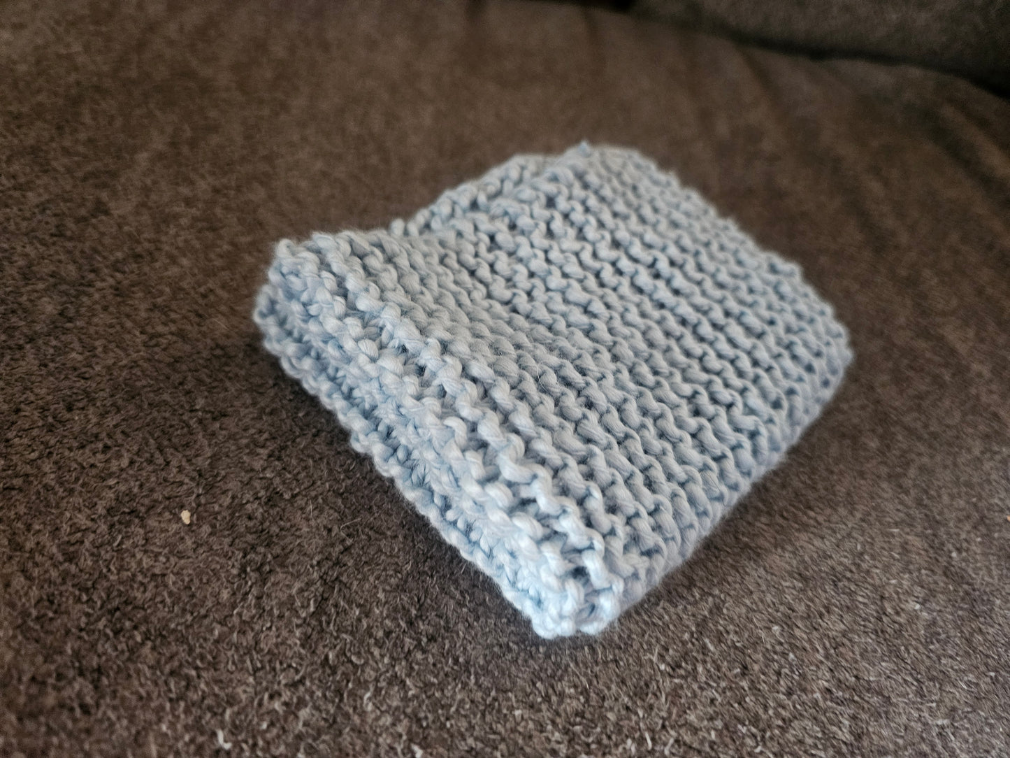 Light blue hand knitted washcloth