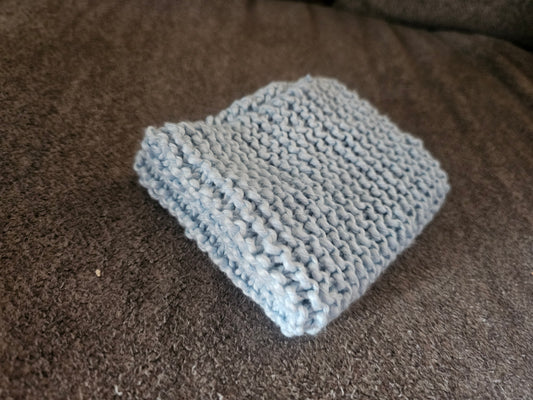 Light blue hand knitted washcloth